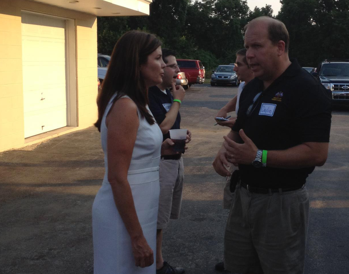 Daylin Leach, right, chats with the state's next Attorney General, Kathleen Kane