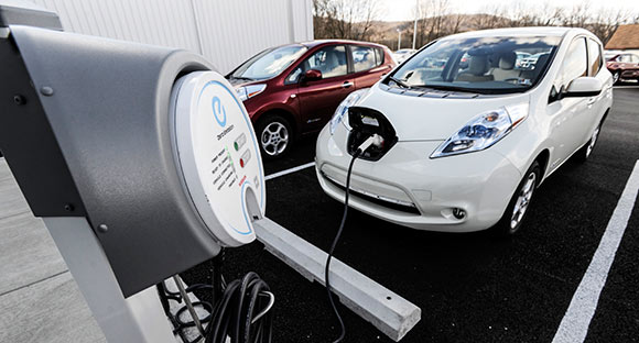 Two Nissian Leaf electric/battery cars  take a charge at the Eisenhauer Nissian Dealership