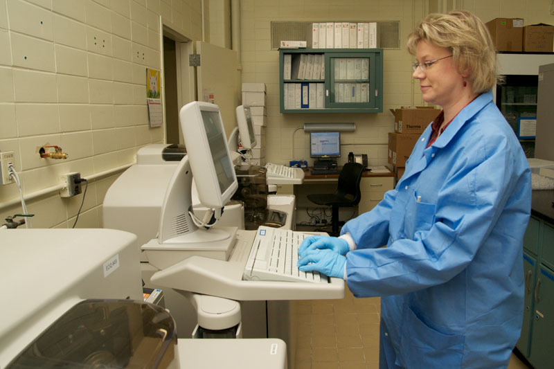 Saladax Principal Scientist Kim Williams at work on the clinical analyzer.