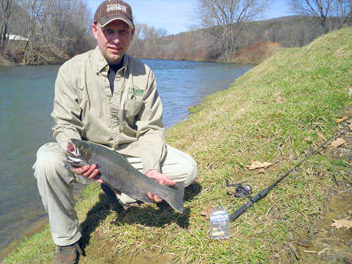 CMT Plant Manager Ivan Smith with one of the Steel Heads he landed while fishing with the TomBob Lure