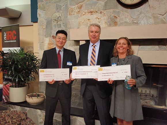 Dr. Kyu Jong, President/CEO Adaptmicrosys, LLC., Thomas Woodward, President of Advanced Power Control Solutions, and Kathy Rzepecki, founder of recap, show off their winnings from the Ben Franklin Big Idea business plan contest.