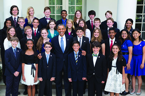 Emma Burnett (fourth girl from right, second row from top) with classmates and President Barack Obama