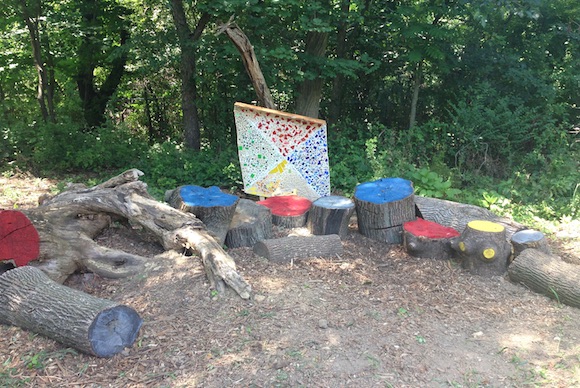 A kite-shaped mosaic and colorful stump area students created to brighten the park