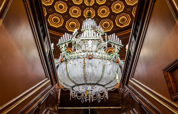 The nearly two ton chandelier in the Benedum Center's auditorium is lowered for it's annual cleaning.