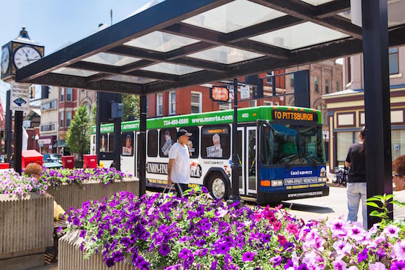 A bus runs through Downtown Charleroi