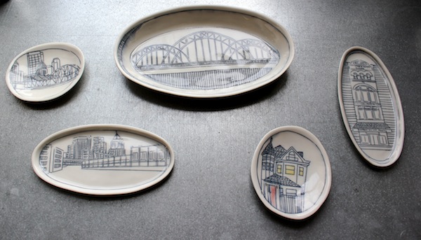 Plates and platters depicting Pittsburgh landmarks.